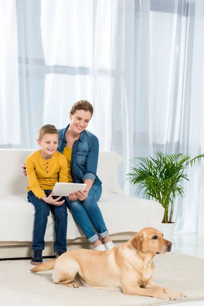 Mother Son Using Tablet Together Dog Lying Floor Foreground — Stock Photo, Image