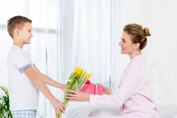 Son Presenting Gift Tulips Bouquet Mother Mothers Day Morning — Stock Photo, Image