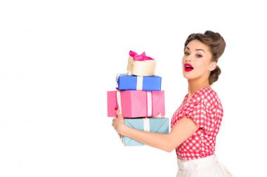 side view of beautiful woman in retro clothing holding wrapped presents isolated on white clipart