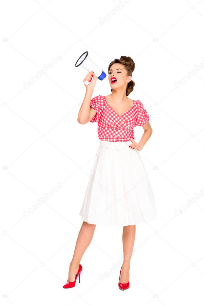 fashionable young woman in pin up style clothing with loudspeaker isolated on white