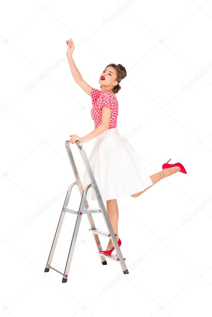 pin up woman standing on ladder isolated on white