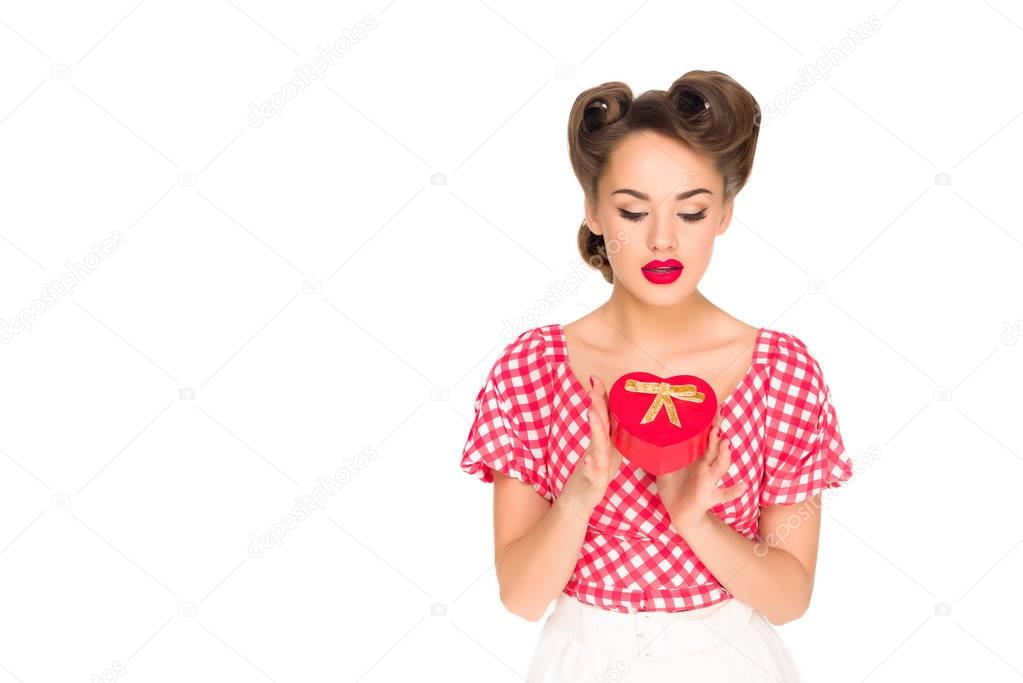 portrait of stylish woman in retro clothing with heart shaped gift isolated on white