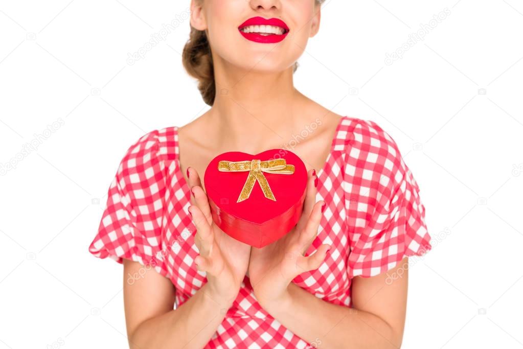 partial view of stylish woman in retro clothing with heart shaped gift isolated on white