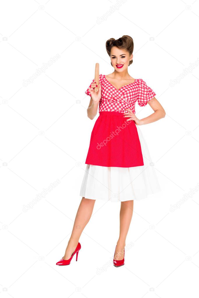 smiling stylish woman in retro clothing with rolling pin isolated on white