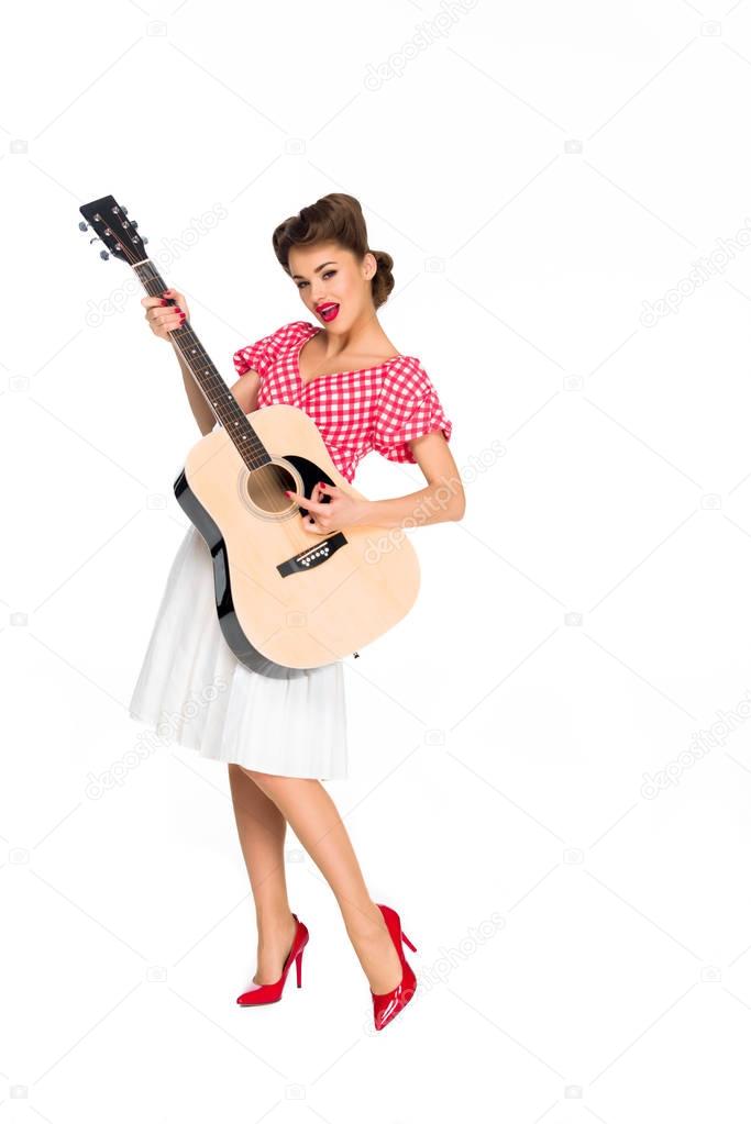 attractive young woman in retro clothing with guitar isolated on white