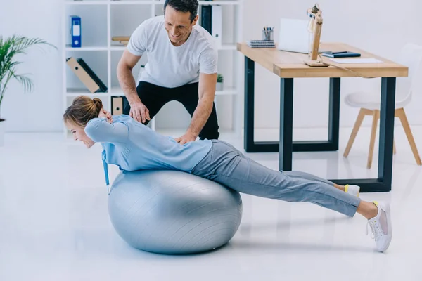 Side View Businesswoman Doing Hyperextension Exercise Fit Ball Trainer Office — Stock Photo, Image