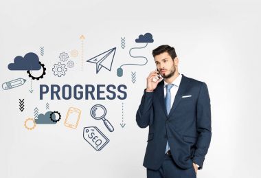 stylish young businessman standing with hand in pocket and talking on smartphone while looking away isolated on grey, progress icons clipart