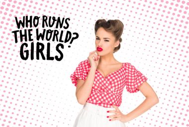 portrait of pensive young woman in retro style clothing with who runs the world? girls quote isolated on white clipart