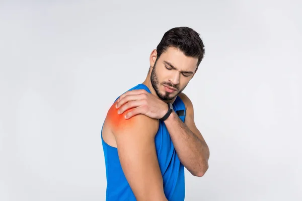 白で隔離する肩の痛みと若い男 — ストック写真