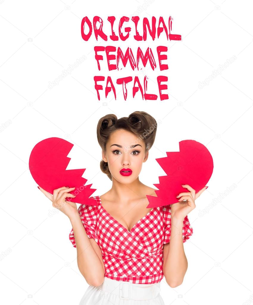 portrait of beautiful young woman in retro clothing with ripped paper heart and original femme fatale lettering isolated on white