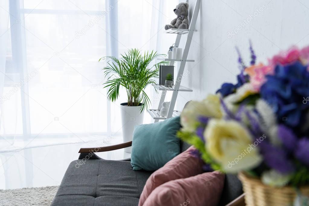 selective focus of sofa with pillows in stylish living room