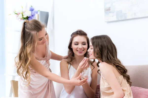 Beautiful Happy Girlfriends Pajamas Smelling Perfume Together — Stock Photo, Image