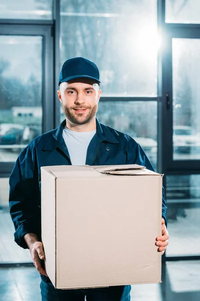 Young Courier Holding Cardboard Box — Stock Photo, Image