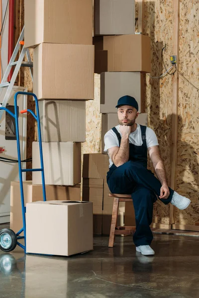 Resting Delivery Man Sitting Stacks Boxes — Stock Photo, Image