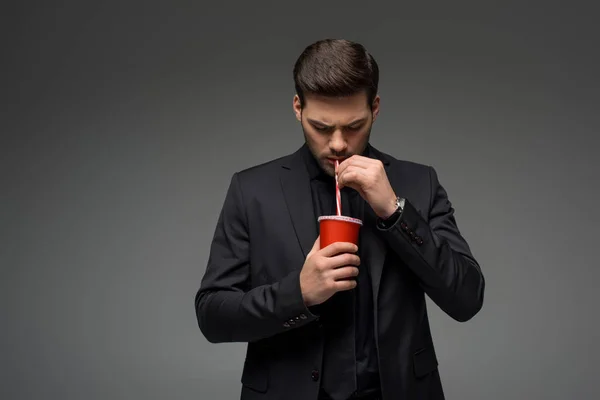 Young Businessman Drinking Disposable Cup Isolated Grey — Free Stock Photo