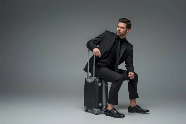 Young Business Tourist Sitting Wheel Suitcase Grey — Stock Photo, Image