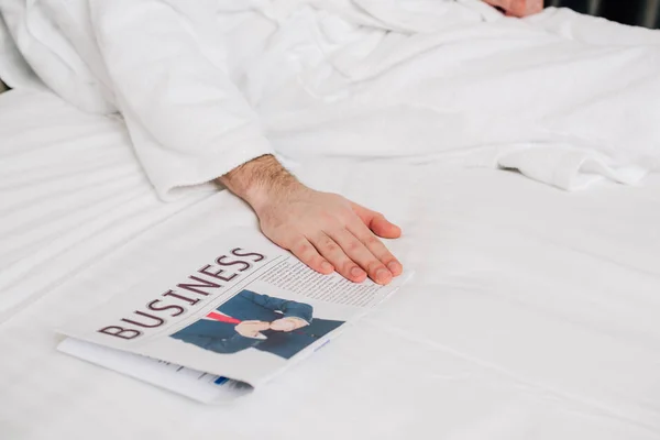 Cropped Shot Man Bathrobe Lying Bed Business Newspaper — Stock Photo, Image