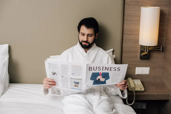 Happy Businessman Bathrobe Reading Newspaper While Relaxing Bed Hotel Suite — Free Stock Photo