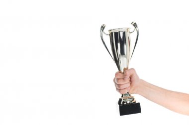 Close up view of silver trophy in hand of sportsman isolated on white clipart