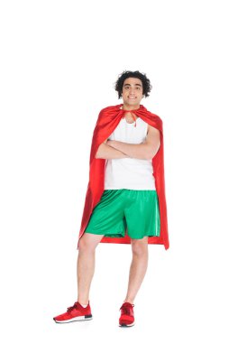 Young thin sprotsman standing in red cape isolated onn white clipart
