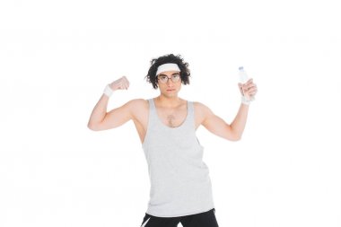 Thin portsman holding bottle of water and showing muscles isolated on white clipart