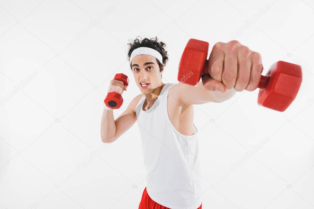 Thin sportsman exercising with dumbbells isolated on white