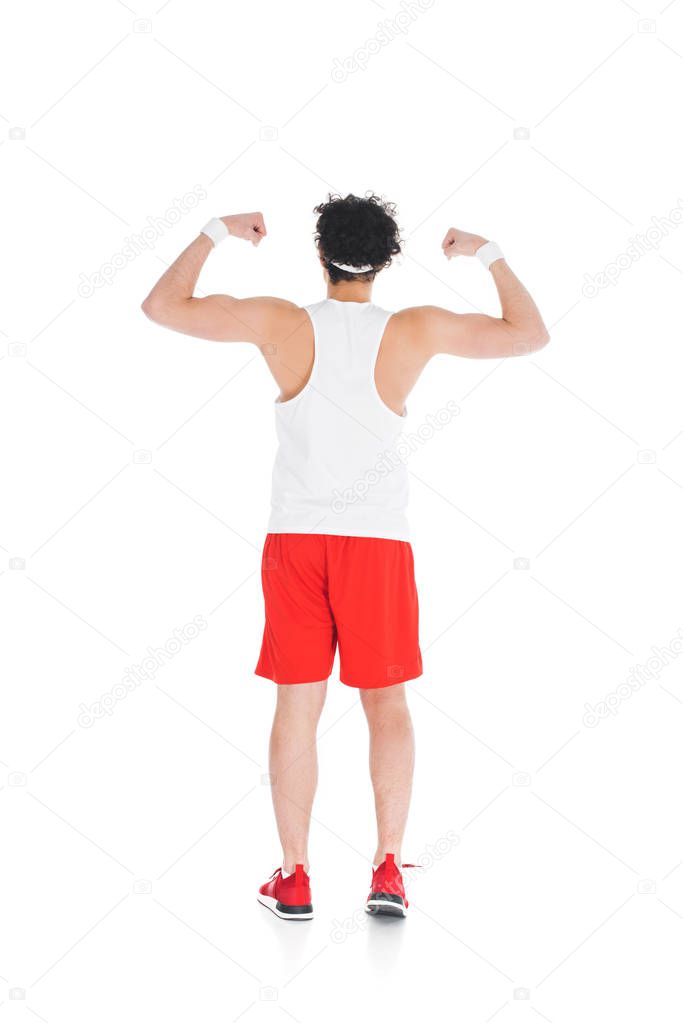 Rear view of skinny sportsman showing muscles on hands isolated on white