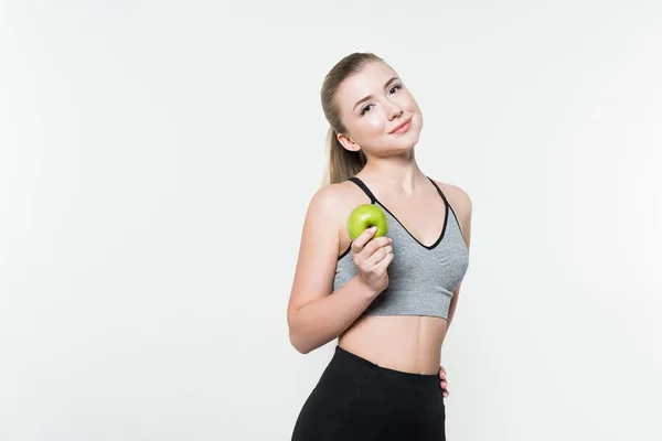 Young Woman Sports Top Holding Apple Isolated White — Free Stock Photo