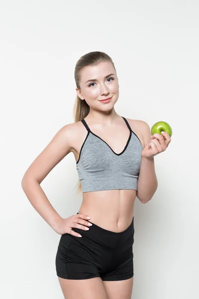 Young Woman Sports Top Holding Apple Isolated White — Free Stock Photo