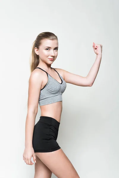 Young Girl Sports Clothes Showing Biceps Isolated White — Free Stock Photo