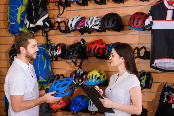 Smiling Young Workers Holding Clipboard Bicycle Helmet Looking Each Other — Stock Photo, Image