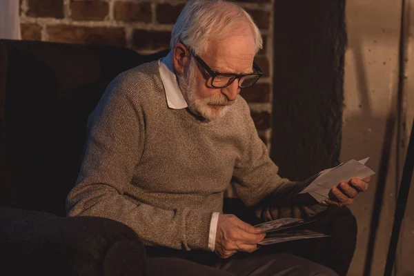 Handsome Grey Hair Man Sitting Armchair Looking Old Photos Home — Stock Photo, Image