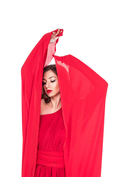 glamorous girl posing in red dress with veil, isolated on white