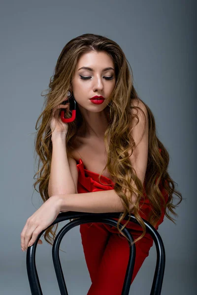 Attractive Woman Long Hair Posing Red Clothes Chair Isolated Grey — Stock Photo, Image