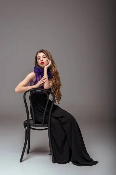 Beautiful Model Black Dress Purple Scarf Sitting Chair Grey — Stock Photo, Image