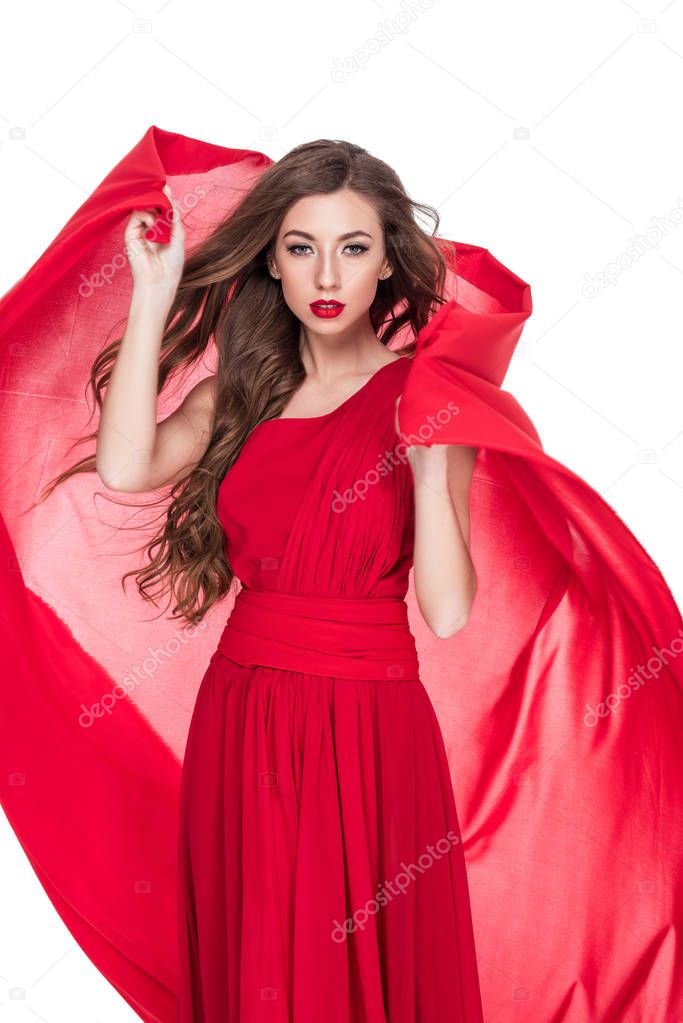beautiful woman posing with red chiffon veil, isolated on white