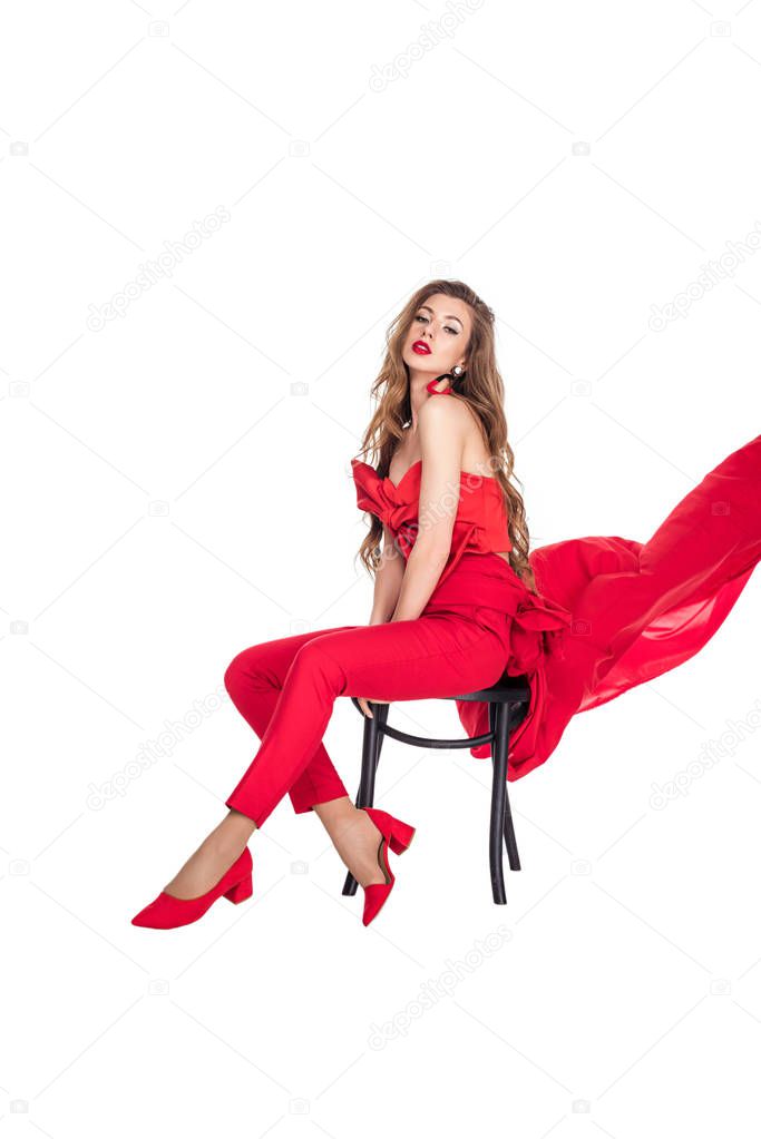 seductive girl posing in red clothes, isolated on white