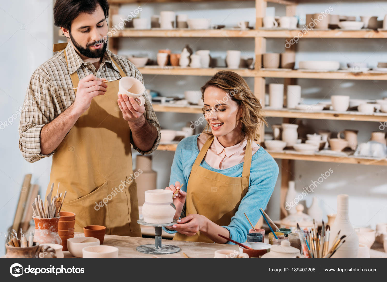 Happy Potters Painting Ceramic Dishware Stock Photo by