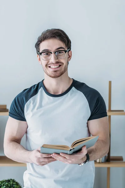 Cheerful Handsome Student Holding Book — Stock Photo, Image
