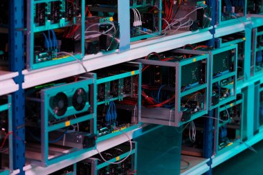 shelves with graphic cards at ethereum mining farm clipart