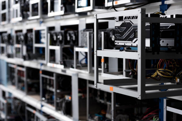 close-up shot of graphic cards on shelves at cryptocurrency mining farm