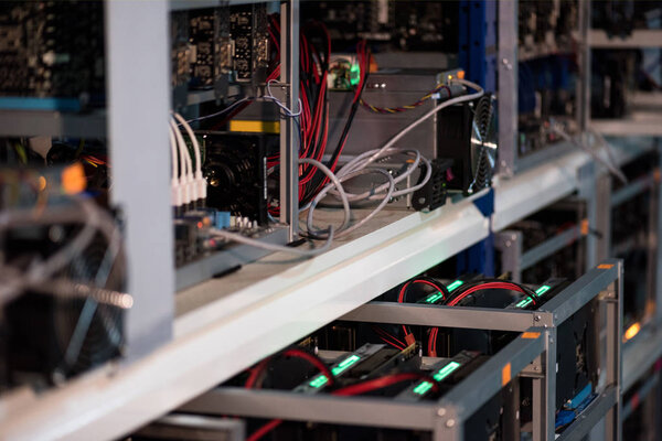 close-up shot of shelf with equipment for bitcoin mining farm