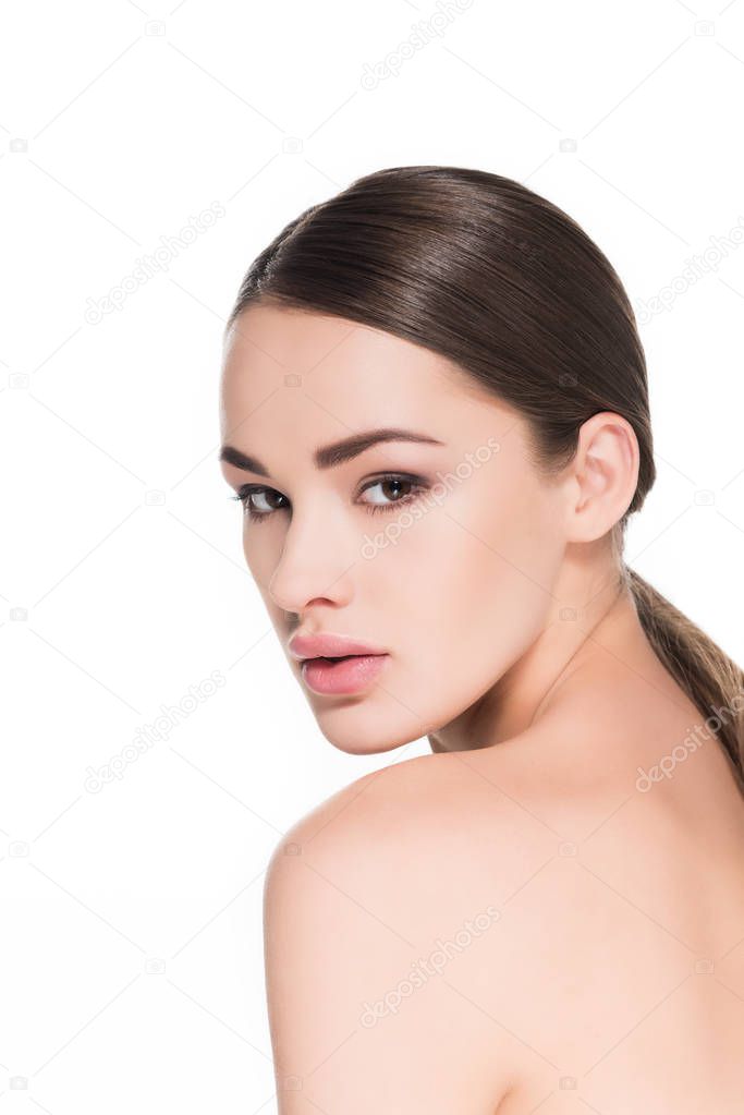 sensual young woman looking back at camera isolated on white