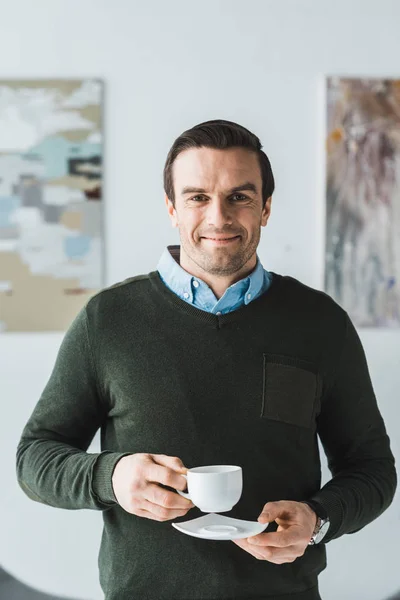 Smiling Man Holding Coffee Cup His Hands — Free Stock Photo