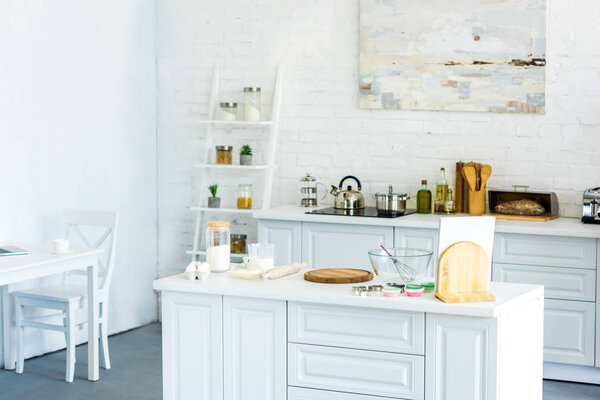 interior of light modern kitchen with paint on wall