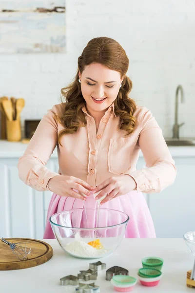 Beautiful Woman Adding Egg Flour Dough Kitchen — Free Stock Photo