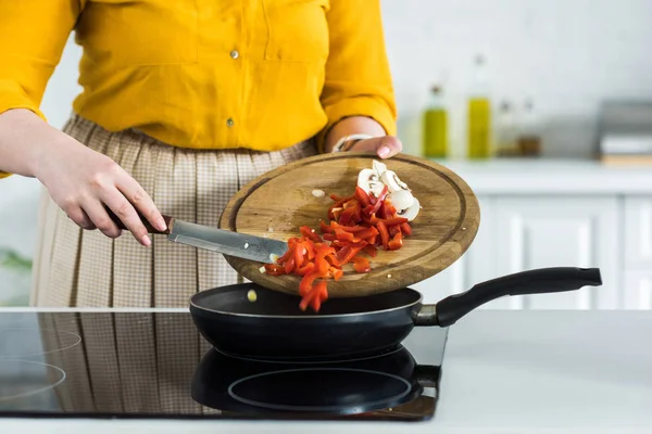 Cropped Image Woman Pouring Out Vegetables Frying Pan Kitchen — Stock Photo, Image