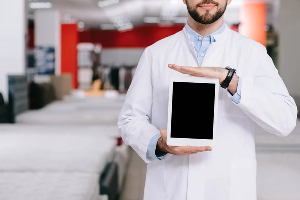 Orthopedist in mattresses store — Stock Photo, Image