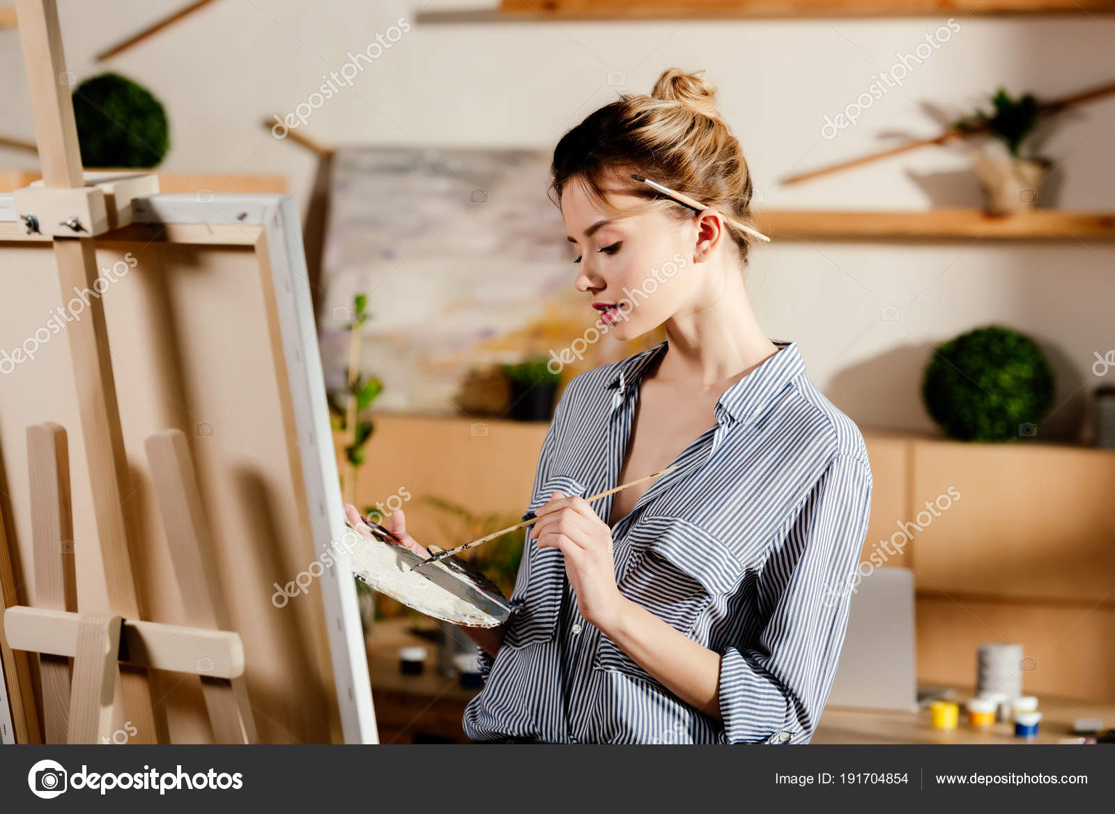 https://st3.depositphotos.com/12982378/19170/i/1600/depositphotos_191704854-stock-photo-female-artist-paintbrush-ear-drawing.jpg