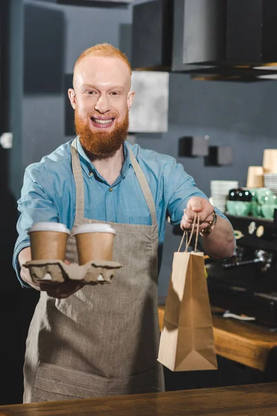 Smiling Bearded Barista Holding Paper Bag Disposable Coffee Cups — Stock Photo, Image